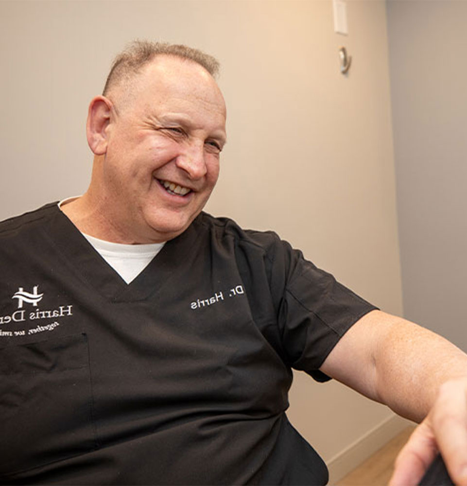 doctor helping with patient within the dental center