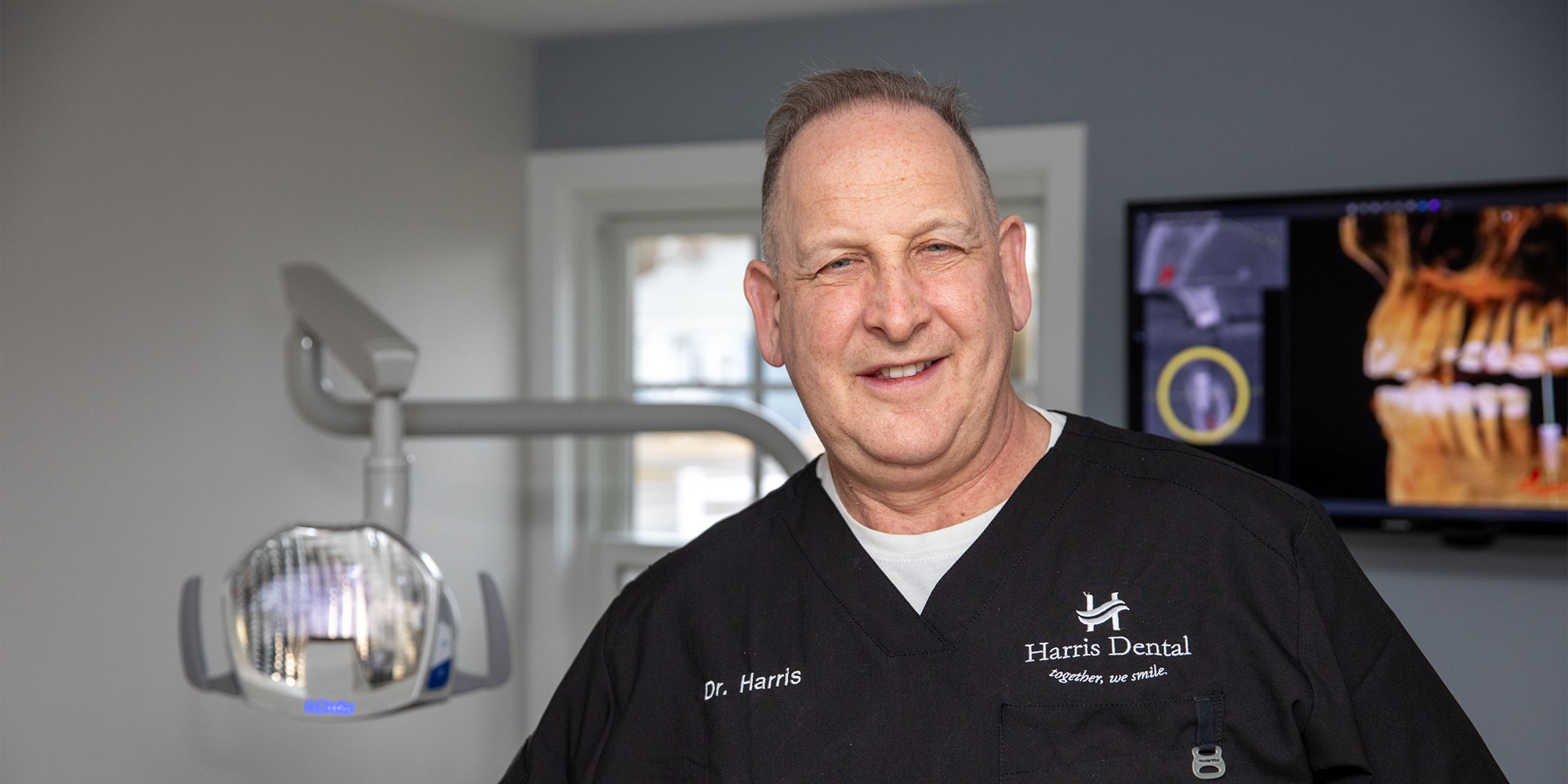 headshot of doctor within the dental center