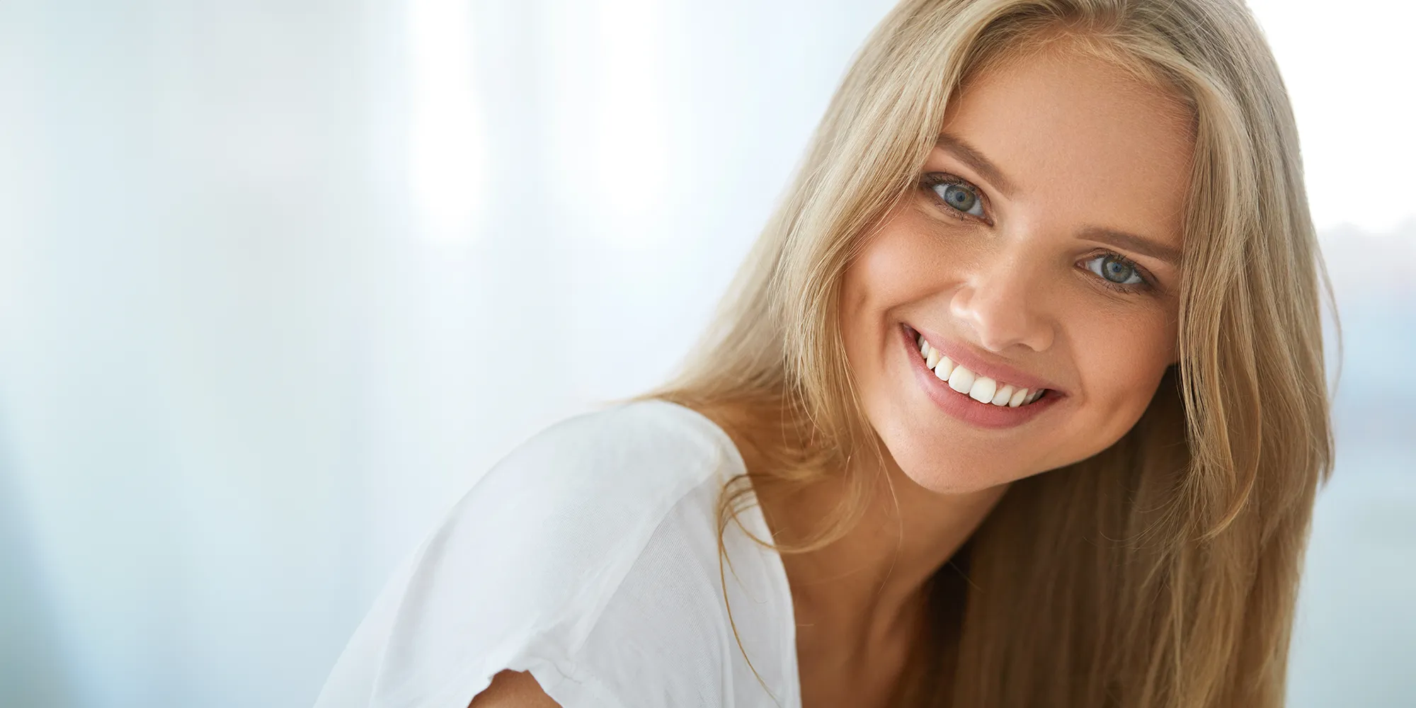 Beautiful Happy Woman With White Teeth Smiling