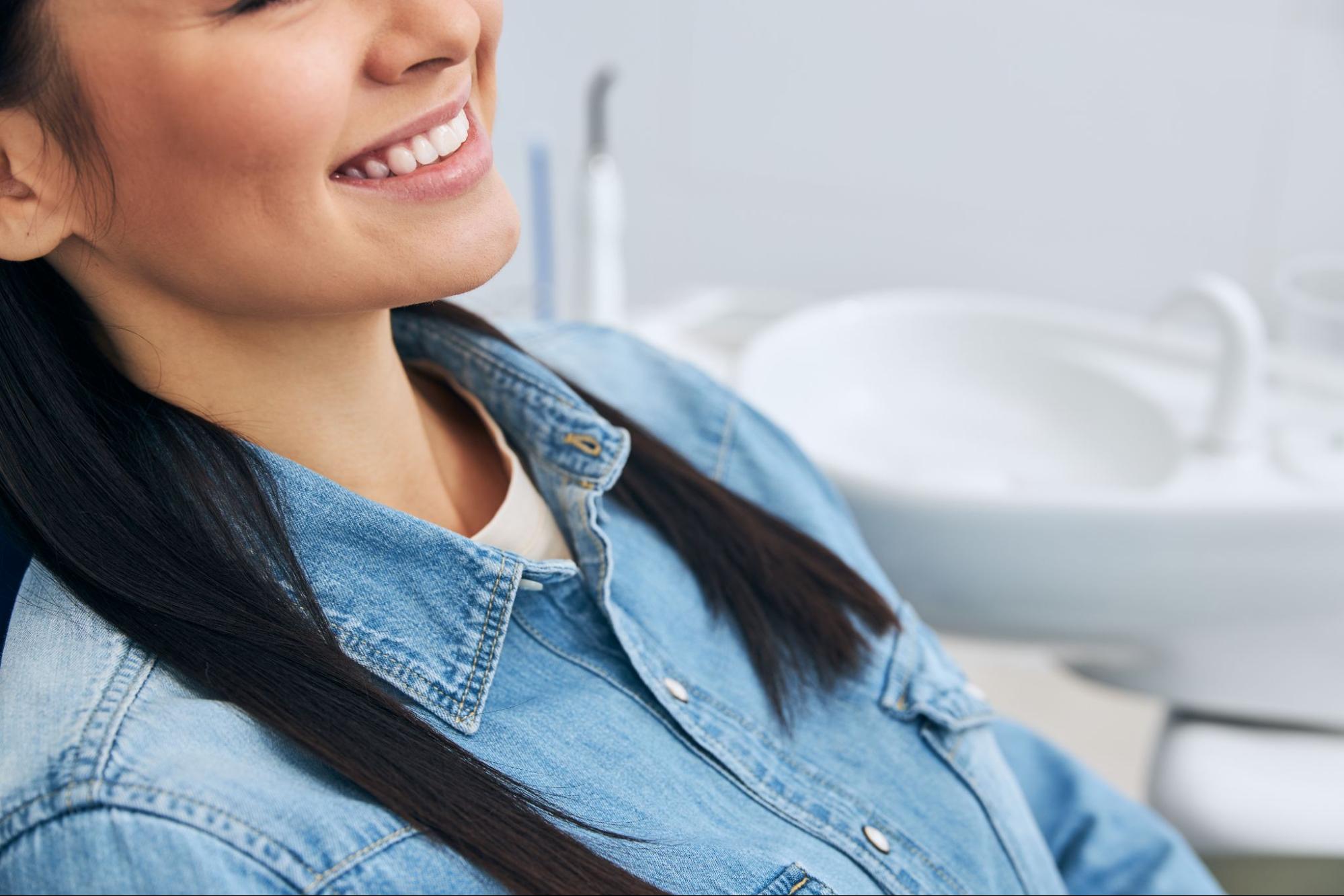 Woman with a white smile at the dentist.