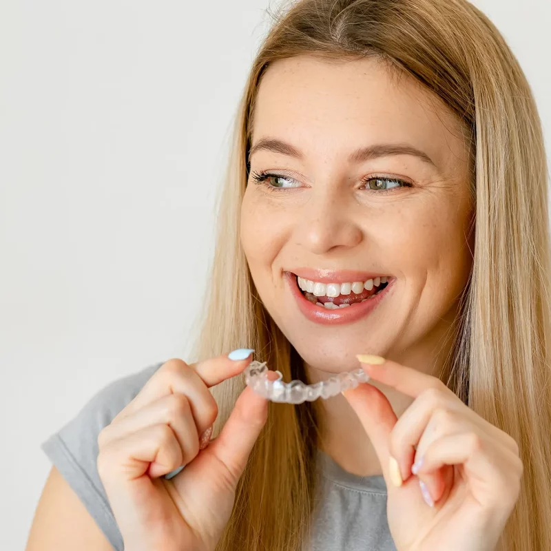 Cheerful woman with Invisalign®.