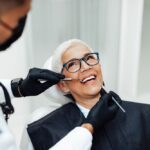 Dentist discussing teeth cleaning with a patient in a modern office