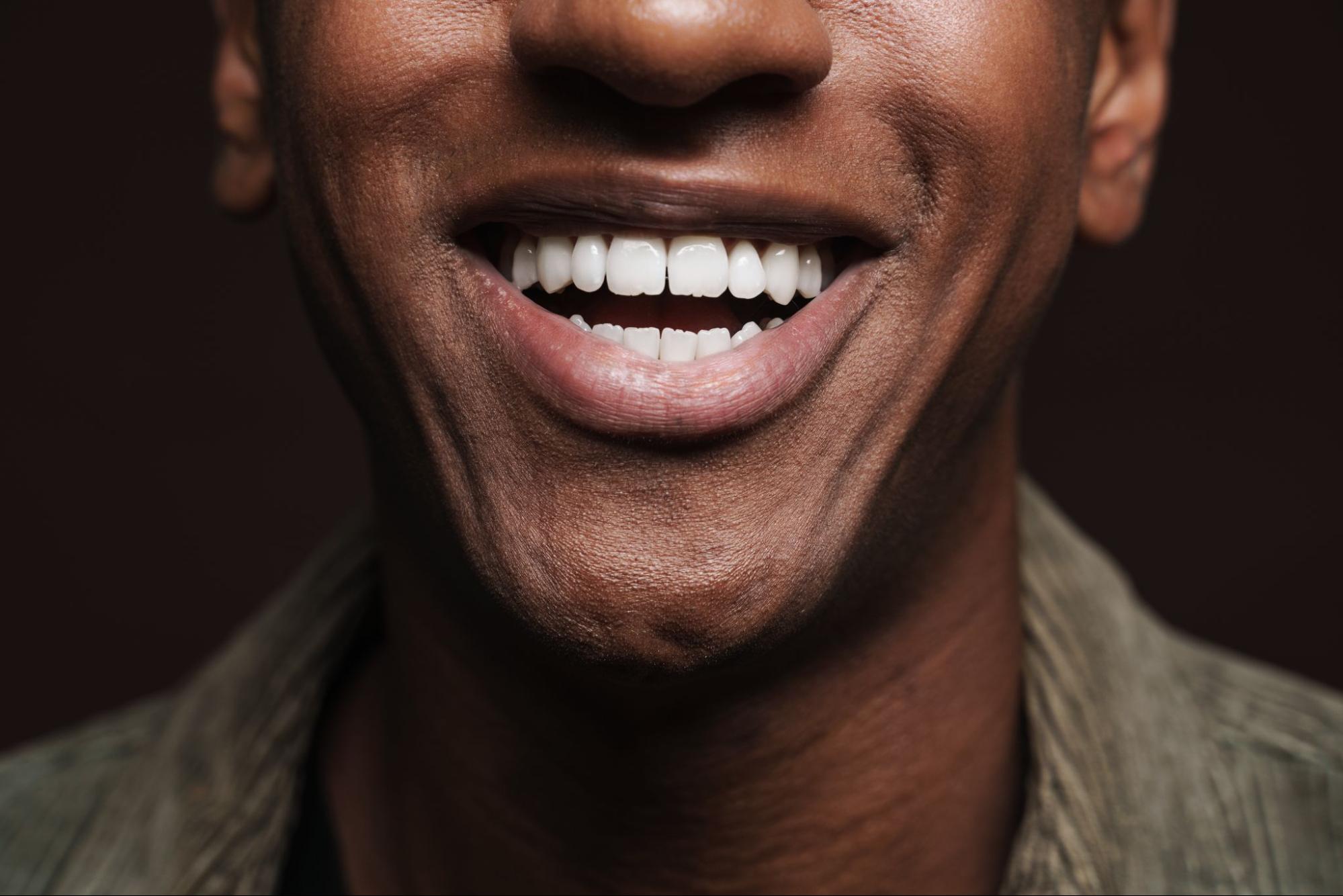 Man with a straight, white smile. 