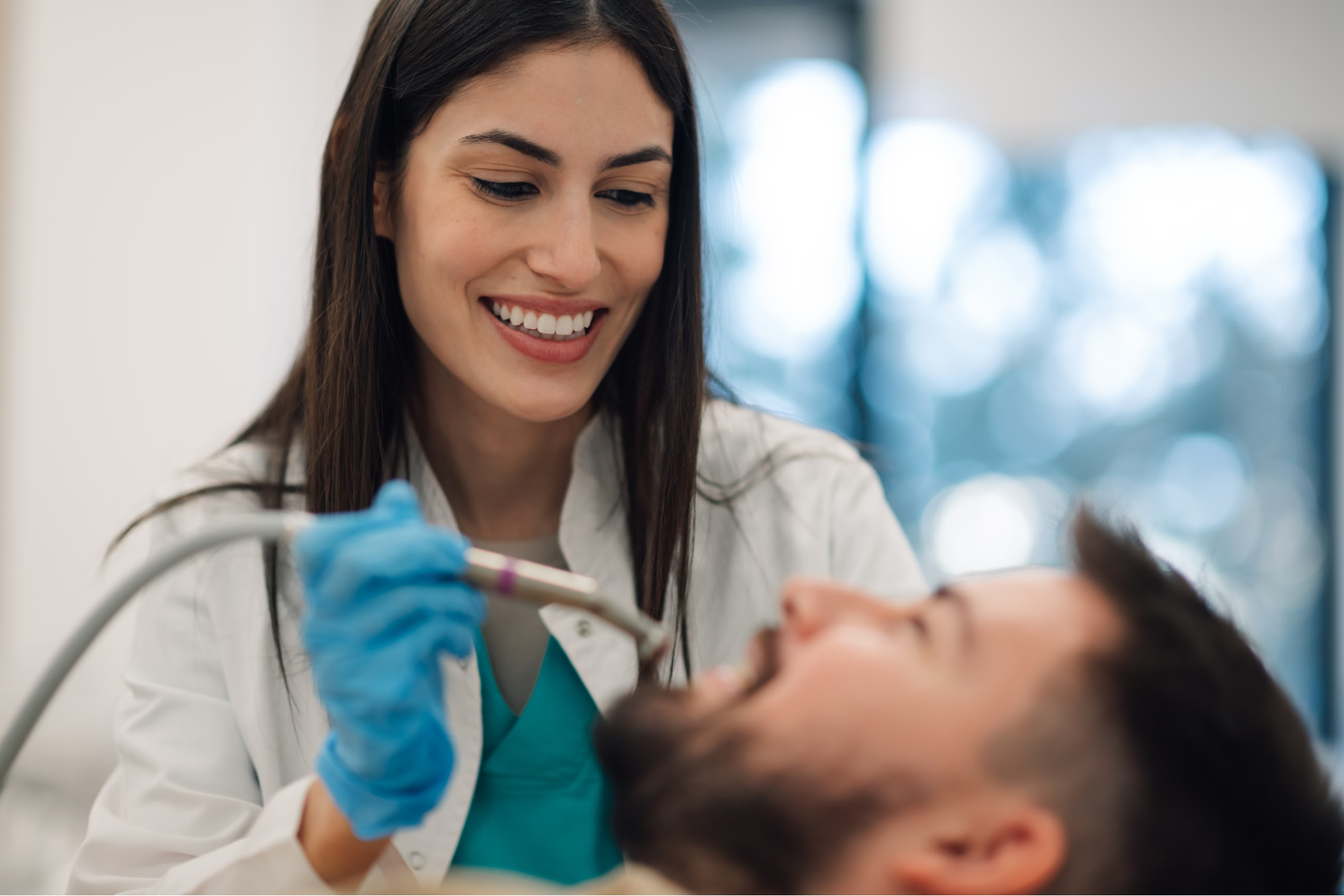 A female dentist working on a patient.