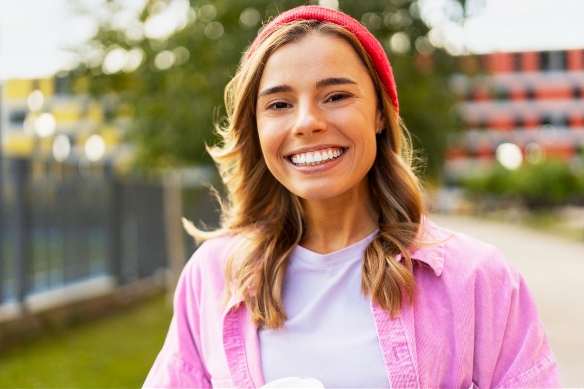 Woman with white teeth smiling. 