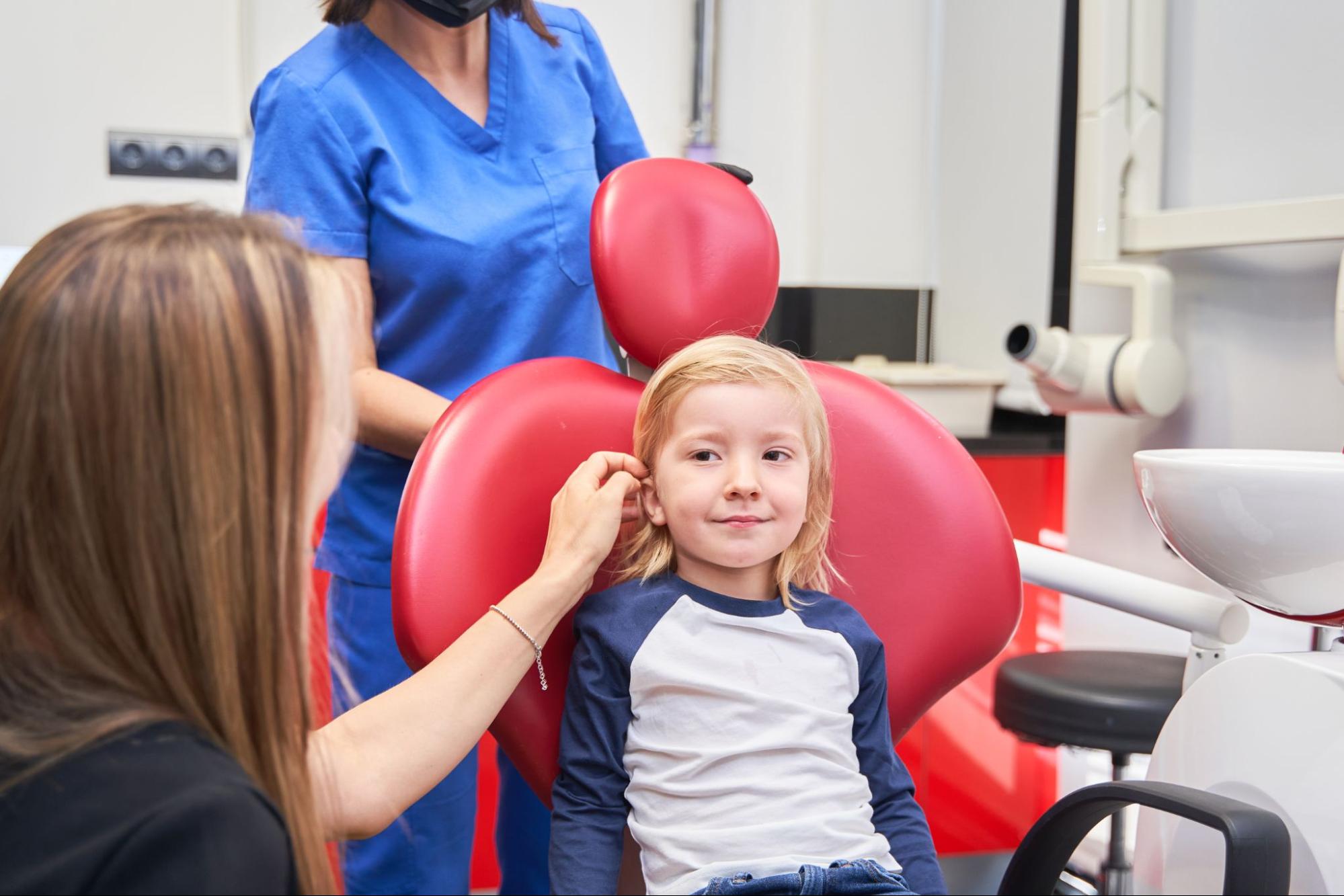 Young girl in a dental exam chair. 