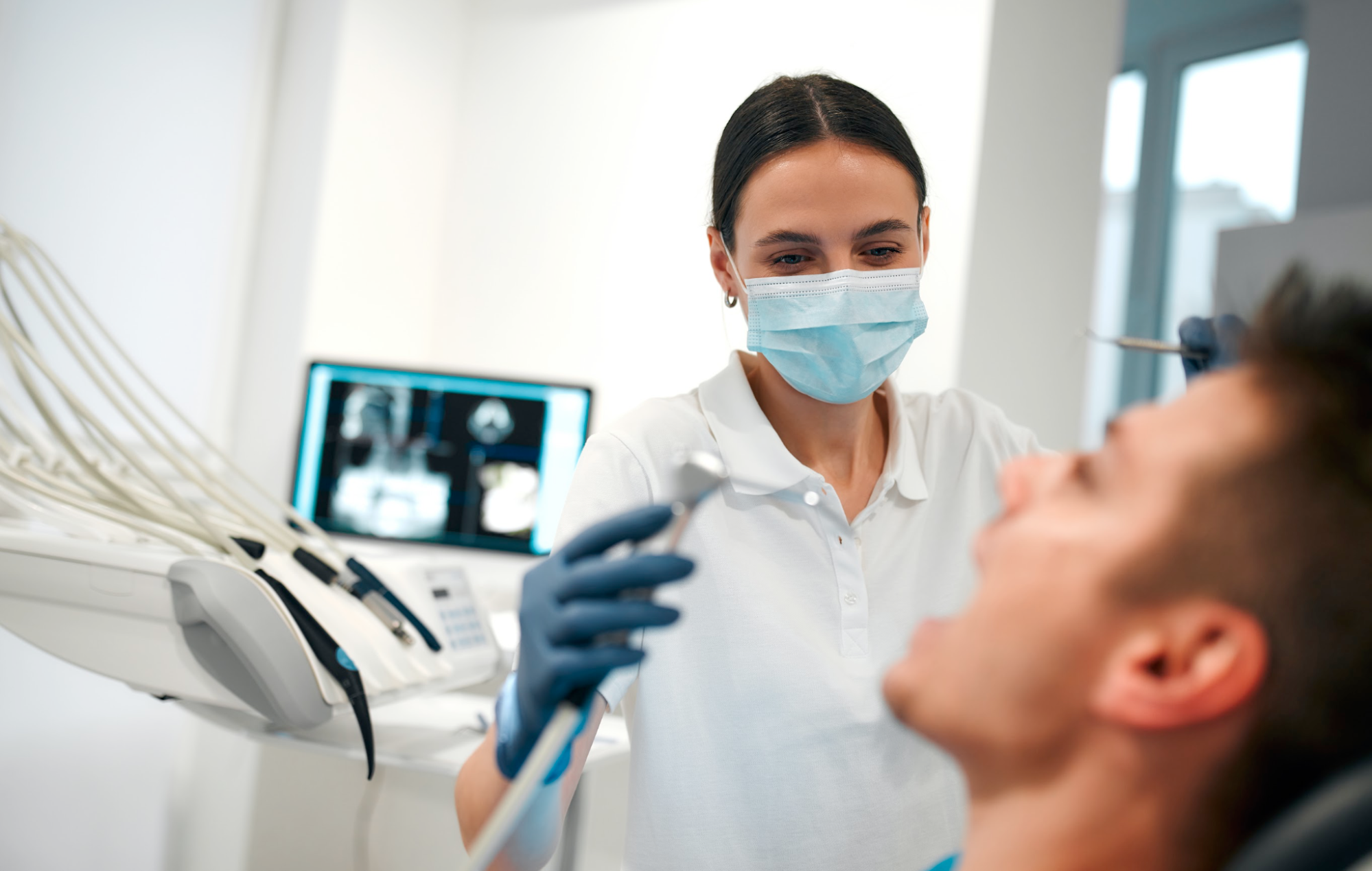 A dentist working on a patient.